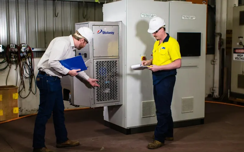 Stolway engineer and technician reviewing a unit